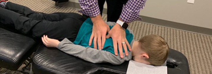 Chiropractor Centerville OH Russell Hulbert Adjusting Back